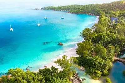 Seychelles Sun-Soaked Sailing: A Pristine Beach Experience from Praslin