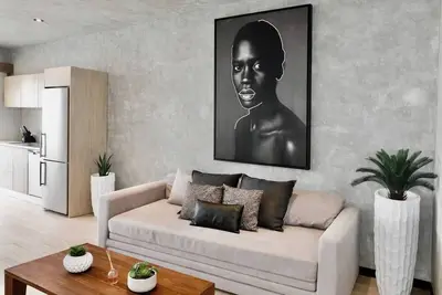 Image de Enjoy Tulum from this comfortable 1br apartment at Tuk Tulum, ideal for up to 4 guests. It features a king bed, queen sofa bed, fully equipped kitchen, private balcony, and access to rooftop pools, paddle tennis courts, parking, and 24/7 security.