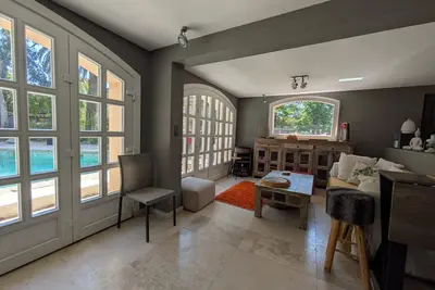 Image de Appartement 'Rez de Jardin Strelizia' avec piscine partagée, Wi-Fi et climatisation