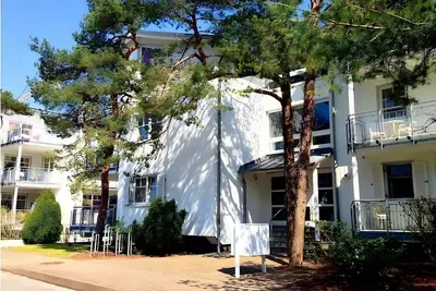 Image de Appartement Seelöwe pour 8 personnes, terrasse de 90 m², transat, jardin commun à Juliusruh