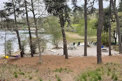 Waterfront on large freshwater pond with private beach right in backyard