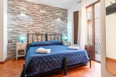 Image de Chambre 'B&B San Domenico - Quadruple Family' avec balcon, Wi-Fi et climatisation