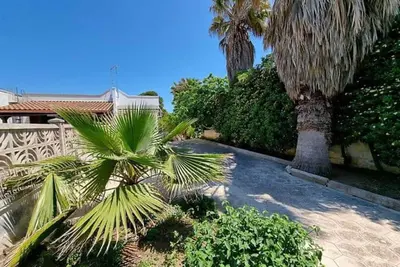 Image de Appartement 'Villa Ruggieri - Terra' avec terrasse privée, jardin privé et climatisation