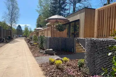 Image de Luxury lodge with private hot tub where indoor and outdoor living blend seamlessly