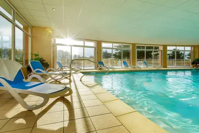 Image de Appartement en bord de mer avec piscine commune