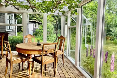 Image de Maison de vacances en bois noir près d'Ebeltoft