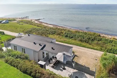 Image de Maison de vacances récemment construite avec vue sur la mer à Assens