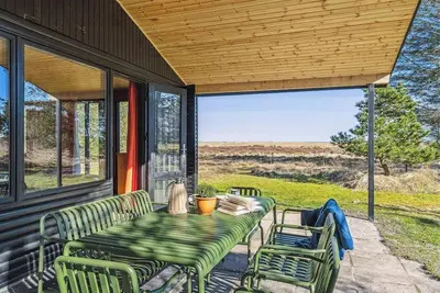 Image de maison de vacances des années 70 avec vue sur la mer à Hals