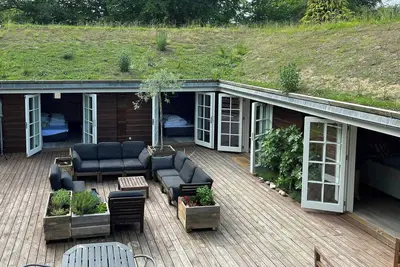 Image de Maison viking traditionnelle près de la plage de Rågeleje