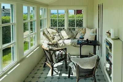 Image de Chalet avec véranda en verre sur la plage d'Apelviken