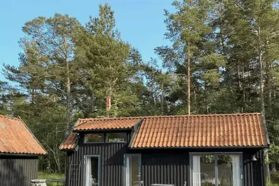 Image de Maison lumineuse avec vue sur le coucher de soleil au-dessus d'Ekeviken, sur l'île de Fårö