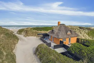 Image de Maison de vacances au toit de chaume près de la mer du Nord à Blokhus
