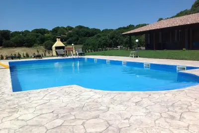 Image de Maison de vacances « Farm Holiday Sa Raighina - Right » avec piscine partagée, Wi-Fi et climatisation