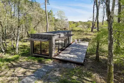 Image de Charming tiny house in forest near sea peace now