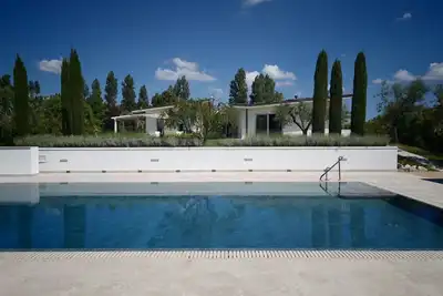 Image de Nestled among the gentle hills of San Marcello, where the eye wanders across lush greenery and the silhouette of the mountains, stands a private villa designed for those who wish to slow down, breathe deeply, and enjoy the luxury of time. Offering 500 sqm