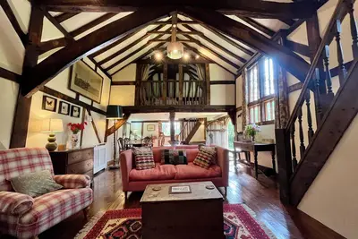 Image de A unique Suffolk timber-framed cottage set within private lawns and woodland.