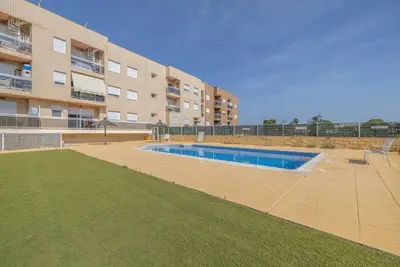 Image de Appartement « Planta Baja Marita » avec piscine partagée, Wi-Fi et climatisation