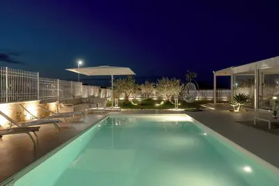 Image de Dimora Olea: an elegant villa with a pool and access to a private beach