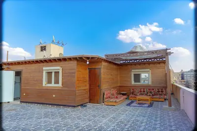 Image de Spacious 2-bedroom apartment with Rooftop between Gem and Giza Pyramids