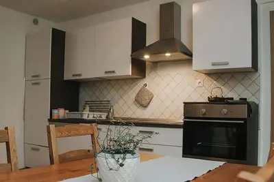 Image de Comfortable one-bedroom apartment in Drežnica near Kobarid, featuring a fully equipped kitchen, free WiFi, air conditioning, and beautiful mountain surroundings.