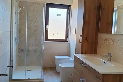 Image de A cozy, new apartment with a beautiful view, nestled between the sea and Aspromonte