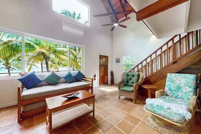 Image de Romantic beachfront home w ocean views, dock, hammock, veranda & free WiFi