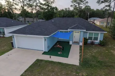 Image de Near Wec-Hot tub-Putt-Putt 3 bed 2 bath Sofa bed 2 gar near Rainbow River/Ocala!