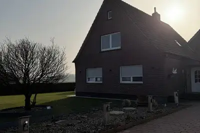 Image de Vacation rental in the heart of Großheide with a panoramic view and a swimming lake