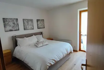Image de Appartement « Bilocale Nuovo Alpe Lusia - Fiemme » avec vue montagne, jardin et Wi-Fi