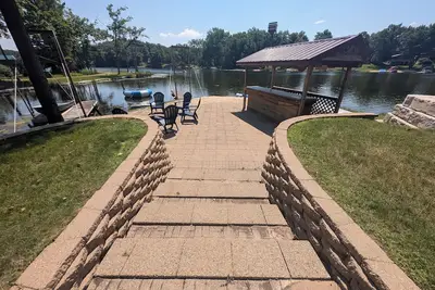 Image de 4-bedroom lake front home with private beach & kayaks in West Branch, Mi with Ac