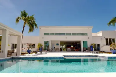 Sunset Serenade. Luxury Waterfront Villa with Private Pool & Dock