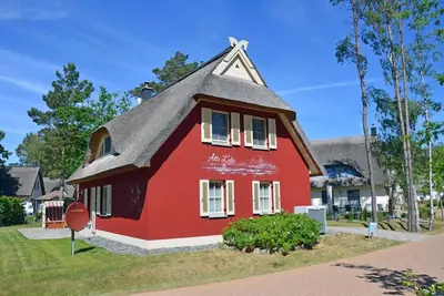 Image de Maison de vacances avec cheminée et sauna, à environ 500 mètres de la plage de sable, 4 chambres, Wi-Fi