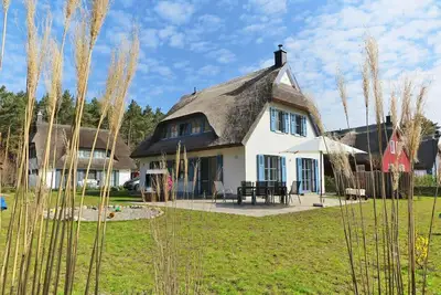 Image de Maison de vacances avec cheminée et sauna, à environ 500 mètres de la plage de sable ; chiens acceptés