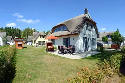 Image de Maison de vacances avec cheminée et sauna, à environ 500 mètres de la plage de sable, Wi-Fi et machine à laver