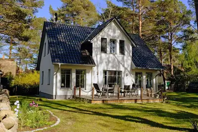 Image de Maison de vacances avec cheminée et sauna, à environ 250 mètres de la plage de sable, Wi-Fi, machine à laver