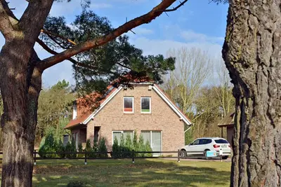 Image de Maison de vacances avec cheminée, à environ 350 mètres de la plage de sable, animaux acceptés