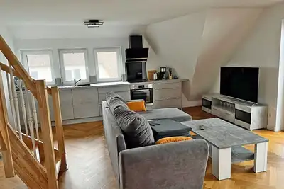 Image de Location de vacances moderne avec cheminée, à environ 1 300 mètres de la plage de sable, 3 chambres, jusqu’à 6 personnes