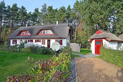Image de Moitié d’une maison de vacances avec cheminée et sauna, juste à côté de la forêt, à environ 500 mètres de la plage de sable
