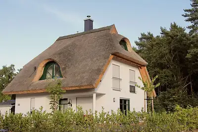 Image de Maison de vacances avec cheminée, à environ 160 mètres de la plage de sable, avec Wi-Fi et machine à laver