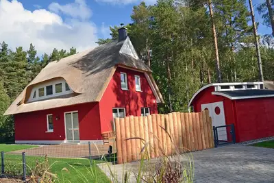 Image de Maison de vacances avec cheminée et sauna, à environ 300 mètres de la plage de sable ; animaux acceptés