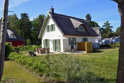 Image de Maison de vacances avec cheminée, à environ 300 mètres de la plage de sable, 2 chambres, jusqu’à 4 personnes