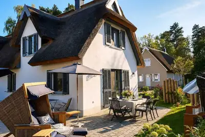 Image de Moitié d’une maison de vacances avec sauna, à environ 600 mètres de la plage de sable, avec machine à laver et Wi-Fi