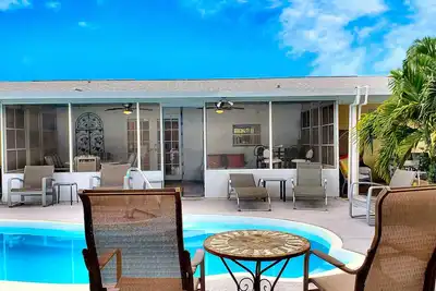 Image de Ab 3/2 piscine privée à la maison pour 10 personnes! À quelques minutes du stade, des plages et du Pga
