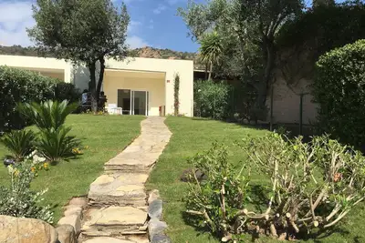 Image de Charme Oleander Villa avec vue sur la mer Ă Is Molas Golf Resort Pula.