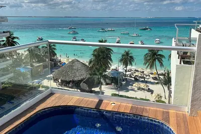 Image de Ixchel Penthouse 504 'Best Rooftop' avec salon
