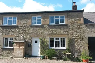 Image de «Les écuries». Un joli chalet en pierre dans le petit village de Powburn.
