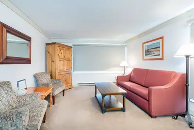 Image de Suite d'angle avec lit king-size et cuisine complète