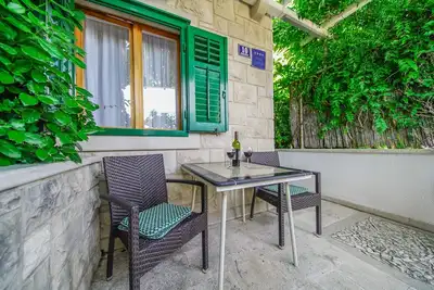 Image de Appartement d'une chambre avec la terrasse et la vue sur le mer Postira, Brac (A-2913-a)