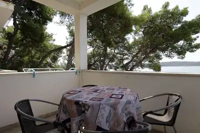 Image de Appartement de deux chambres avec la terrasse et la vue sur le mer Trogir (A-11895-a)
