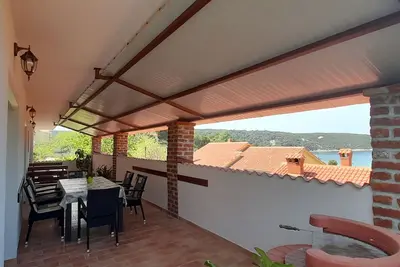 Image de Appartement de deux chambres avec la terrasse et la vue sur le mer Kampor, Rab (A-5056-a)